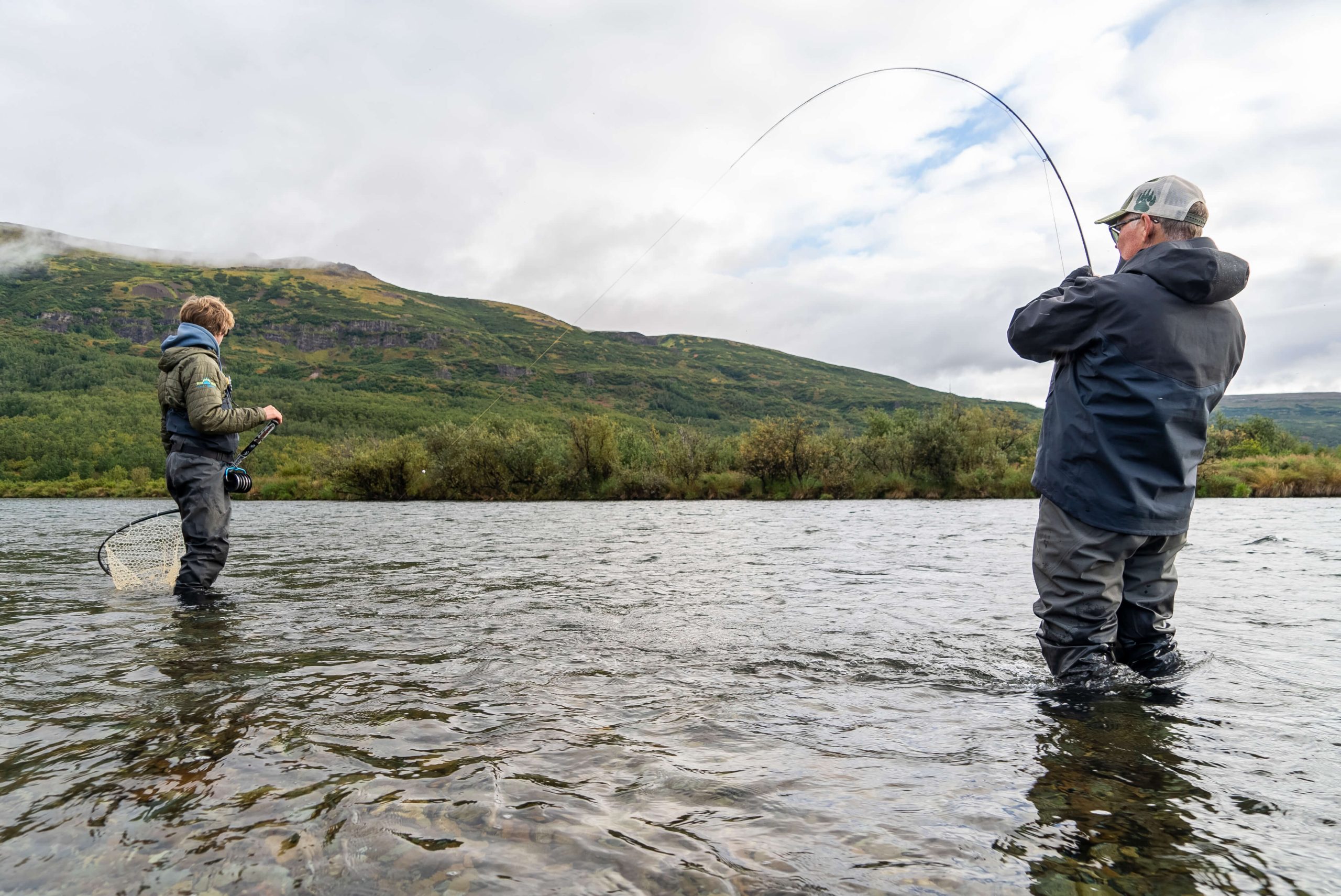 Man holding an Alaskan Salmon at Bear Trail Lodge